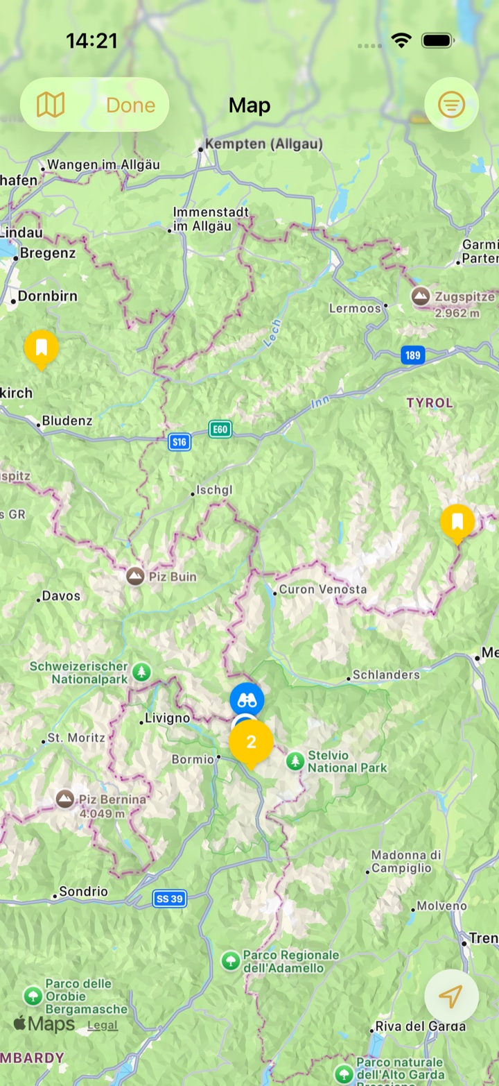 The map zoomed out over the Alps with yellow bookmark markers for bucket list passes and a cluster of two near Bormio